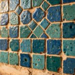 Handmade Moroccan zellige tiles with glossy blue-green glaze